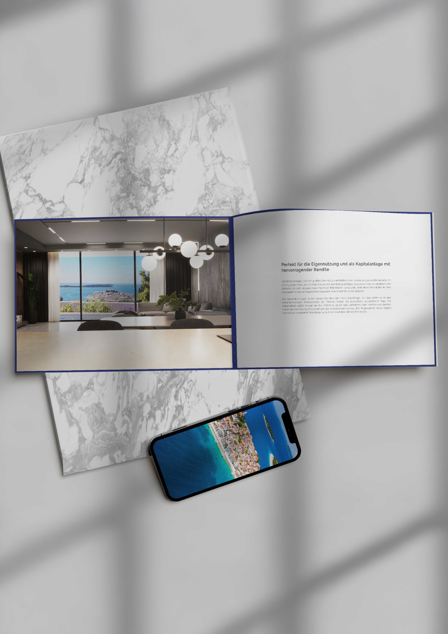 Villa Unuk: brochure and phone on marble